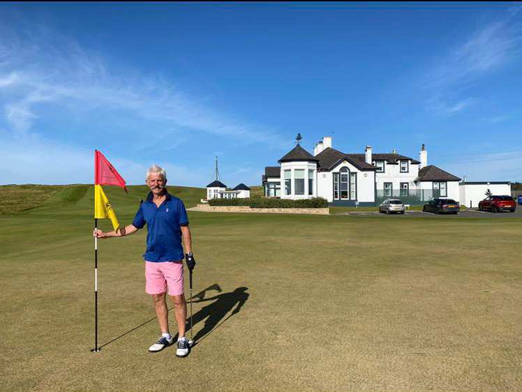 Golfing Society - Charlie Crummey in traditional Scottish blue skies and pink shorts